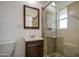 Bathroom featuring a vanity, toilet, and tiled stand up shower with glass doors at 5038 N 20Th Ave, Phoenix, AZ 85015