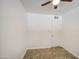 Simple bedroom with neutral walls, tile floor and a ceiling fan at 5038 N 20Th Ave, Phoenix, AZ 85015