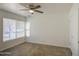 Bedroom with tile floors, a ceiling fan, and large windows at 5038 N 20Th Ave, Phoenix, AZ 85015