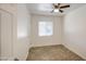 Bright bedroom with window, ceiling fan, and tile flooring at 5038 N 20Th Ave, Phoenix, AZ 85015