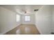 View of a bedroom featuring tile floor, ceiling fan, and two windows at 5038 N 20Th Ave, Phoenix, AZ 85015