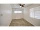 Clean and simple bedroom with a ceiling fan and natural light from two windows at 5038 N 20Th Ave, Phoenix, AZ 85015