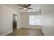 Bedroom with tile floors, a ceiling fan, and an ensuite bathroom with stand up shower at 5038 N 20Th Ave, Phoenix, AZ 85015