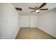 Bedroom with a ceiling fan, tile flooring, and closet with sliding doors at 5038 N 20Th Ave, Phoenix, AZ 85015