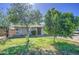 Charming single-story home featuring a well-maintained lawn and mature shade trees at 5038 N 20Th Ave, Phoenix, AZ 85015