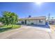 Single-level home featuring mature trees, landscaping and a concrete driveway at 5038 N 20Th Ave, Phoenix, AZ 85015