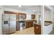 Updated kitchen with stainless steel appliances, granite countertops, and tiled floors at 5038 N 20Th Ave, Phoenix, AZ 85015