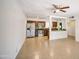 Open concept living and kitchen area with stainless steel appliances and tile floors at 5038 N 20Th Ave, Phoenix, AZ 85015