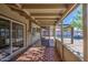 Covered patio with brick flooring and screened windows looking out to the pool at 5038 N 20Th Ave, Phoenix, AZ 85015