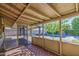 Covered patio with brick flooring and screened windows overlooking the backyard and pool area at 5038 N 20Th Ave, Phoenix, AZ 85015