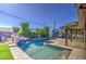 Spacious pool area with a rock waterfall and a charming recreation house at 5038 N 20Th Ave, Phoenix, AZ 85015