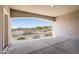 Covered back patio view showing outdoor space and desert landscape at 5221 N Tuthill Rd, Litchfield Park, AZ 85340