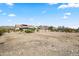Spacious backyard features desert landscaping, a volleyball court, and mature foliage at 5221 N Tuthill Rd, Litchfield Park, AZ 85340