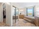 A bathroom with a walk-in closet, garden tub, double vanity, and tile floors at 5221 N Tuthill Rd, Litchfield Park, AZ 85340