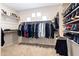 Spacious walk-in closet with ample storage and organization racks at 5221 N Tuthill Rd, Litchfield Park, AZ 85340