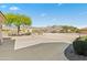 Expansive driveway leading to this desert oasis, with mountain views and desert vegetation at 5221 N Tuthill Rd, Litchfield Park, AZ 85340