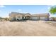 Sprawling home with neutral stucco, tile roof, circular driveway, and a convenient three-car garage at 5221 N Tuthill Rd, Litchfield Park, AZ 85340