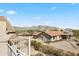 Stunning home exterior boasts mountain views and a tile roof, adding natural beauty to this desert landscape at 5221 N Tuthill Rd, Litchfield Park, AZ 85340