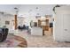 A kitchen with a breakfast bar, granite countertops, stainless steel appliances, and tile floors at 5221 N Tuthill Rd, Litchfield Park, AZ 85340