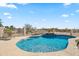 Beautiful in-ground pool with integrated jacuzzi and plenty of space for recreation at 5221 N Tuthill Rd, Litchfield Park, AZ 85340