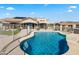 Stunning in-ground pool with spacious seating and mountain views create an oasis at 5221 N Tuthill Rd, Litchfield Park, AZ 85340