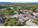 Overhead perspective of a community with lush greenery, swimming pools and residential solar panels at 5353 W Dublin Ct, Chandler, AZ 85226