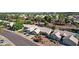 A high-angle view shows houses with neat landscaping and tile roofs, complemented by an artificial turf yard at 5353 W Dublin Ct, Chandler, AZ 85226
