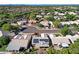 Aerial shot of a neighborhood highlighting its circular streets and houses equipped with solar panels at 5353 W Dublin Ct, Chandler, AZ 85226