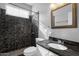 Modern bathroom with dark tiled shower, rainfall shower head, and marble countertop at 5353 W Dublin Ct, Chandler, AZ 85226