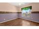 Cozy bedroom with large window, decorative border, and hardwood floors at 5353 W Dublin Ct, Chandler, AZ 85226