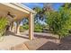 Spacious covered patio with a ceiling fan and beautiful views of the landscaped backyard at 5353 W Dublin Ct, Chandler, AZ 85226