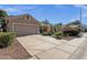 Street view of a single-story home with desert landscaping and a large driveway at 5353 W Dublin Ct, Chandler, AZ 85226