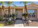 Inviting home entrance with palm trees and a security system sign at 5353 W Dublin Ct, Chandler, AZ 85226