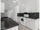 Modern kitchen design with white cabinetry, granite countertops, and stainless steel appliances at 5353 W Dublin Ct, Chandler, AZ 85226