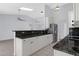 Bright kitchen featuring granite counters, stainless steel appliances, and white cabinetry at 5353 W Dublin Ct, Chandler, AZ 85226