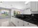 Open kitchen area with granite countertops, undermount sink, and bright natural light at 5353 W Dublin Ct, Chandler, AZ 85226