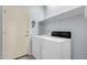 Functional laundry room with washer, dryer, and storage shelf for convenience at 5353 W Dublin Ct, Chandler, AZ 85226