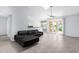 Bright living room with tile floors, skylight, and sliding glass doors at 5353 W Dublin Ct, Chandler, AZ 85226