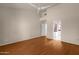 Spacious living room with hardwood floors, high ceilings, and an open doorway at 5353 W Dublin Ct, Chandler, AZ 85226