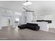 Open-concept living space with tile flooring, skylight, and a kitchen view at 5353 W Dublin Ct, Chandler, AZ 85226
