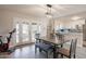 This dining area has a modern light fixture, and direct access to the backyard at 5607 N 23Rd Ave, Phoenix, AZ 85015