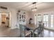 Cozy dining room with stylish decor and lots of light from a large window at 5607 N 23Rd Ave, Phoenix, AZ 85015