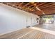 Spacious garage interior, painted white with overhead lighting and door to exterior at 5607 N 23Rd Ave, Phoenix, AZ 85015