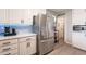 Modern kitchen featuring stainless steel appliances, quartz countertop, and ample cabinet space at 5607 N 23Rd Ave, Phoenix, AZ 85015