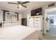 The main bedroom features a king bed, dresser and large mirror at 5607 N 23Rd Ave, Phoenix, AZ 85015