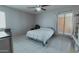 A light-filled bedroom with tile floors and a large window at 6546 N 71St Ave, Glendale, AZ 85303