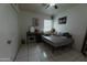 A bedroom with tile floors, a ceiling fan and bright natural light at 6546 N 71St Ave, Glendale, AZ 85303