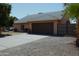 Charming single-story home featuring a well-maintained front yard and a two-car garage at 6546 N 71St Ave, Glendale, AZ 85303