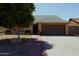 Charming single-story home featuring a well-maintained front yard and a two-car garage at 6546 N 71St Ave, Glendale, AZ 85303