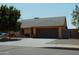 Charming single-story home featuring a well-maintained front yard and a two-car garage at 6546 N 71St Ave, Glendale, AZ 85303